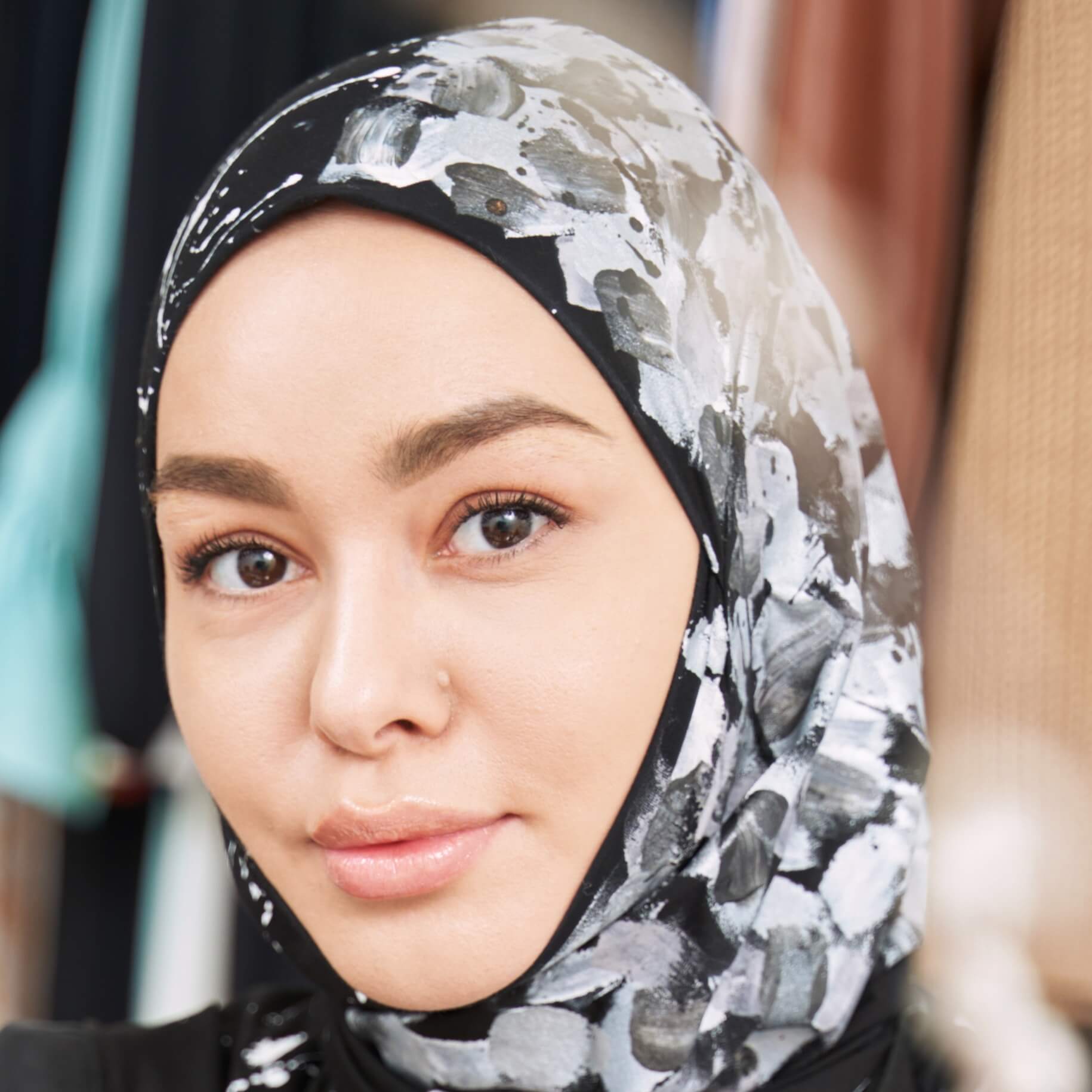 smiling young woman making sketches of islamic fas 2022 03 25 18 55 43 utc cropped.jpg